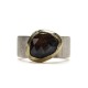 Heavy silver ring with a facetted Iolite Sunstone set in 14K gold